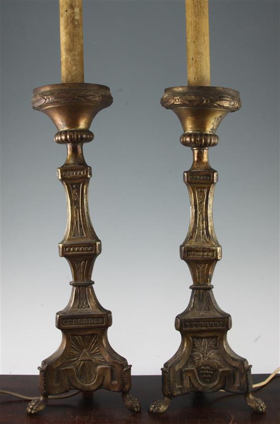 A pair of Italian style brass altar sticks, overall height 34in.